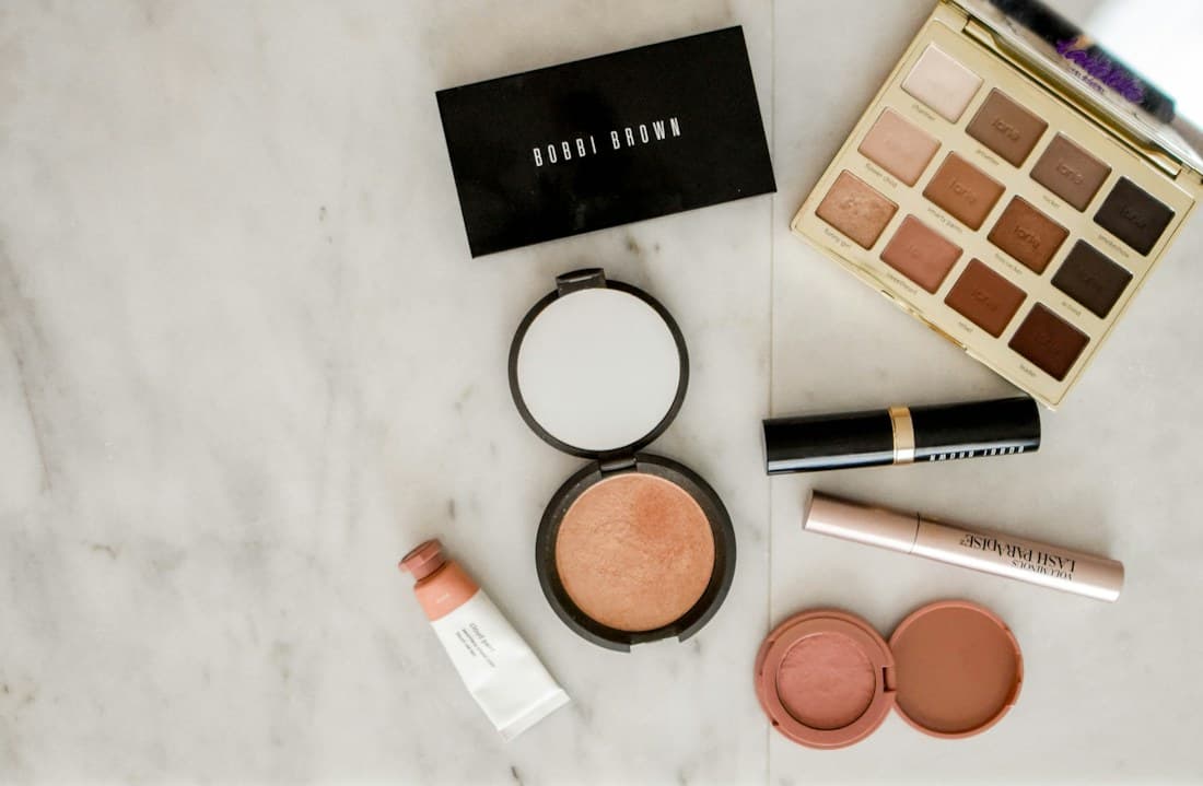 A palette of soft rose and warm neutral makeup